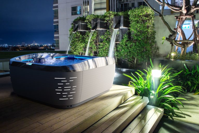 J-575 Jacuzzi Hot Tub installation at night